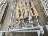 a lot of metal and wood pallets in a warehouse