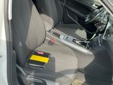 the interior of a car with the door open and the seat up