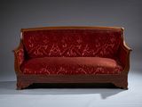 an image of a red couch against a gray background