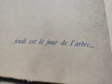 an open book with writing on it sitting on top of a table