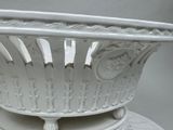 a large white bowl sitting on top of a table