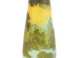 a vase with a mountain scene painted on it