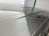 an image of a car in a garage with its hood up