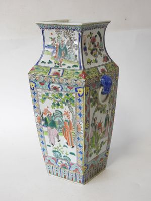 a vase that is sitting on a white surface