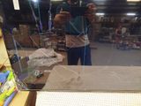 a man that is taking a picture of himself in the mirror