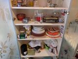 a pantry with a lot of dishes and dishes on the shelves