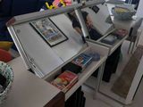 a refrigerator that is open on a table in a living room