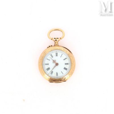 a gold pocket watch with roman numerals on the face