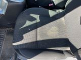 a dirty seat in the back of a car