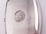 an image of a close up of a watch on a white surface