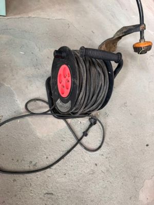 a hose that is sitting on the floor next to a hose