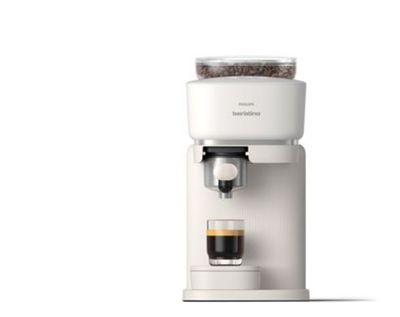 an image of a white coffee maker with a cup of coffee