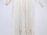 an image of a white dress hanging on a hanger