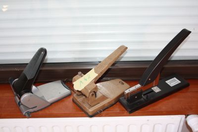 a stapler, stapler, stapler, and stapler on a desk