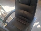 a black office chair that is sitting in a room