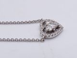 an image of a heart shaped diamond pendant on a chain