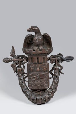 an image of a bronze statue of a bird with a crown on it