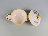 a close up of a cup and saucer sitting on a table