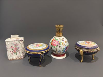four different types of vases sitting on top of a table