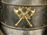 a helmet with two crossed axes on top of it