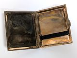 a small metal box with a mirror inside of it