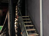 a ladder that is leaning against a wall in a room