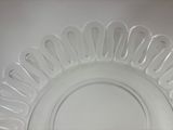 a clear glass plate with a decorative design on it