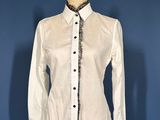 the shirt is white and has a black and white pattern on it