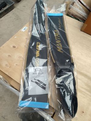 a pair of skis sitting on top of a wooden table