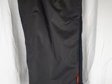 the pants are hanging on the clothes rack in the room