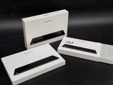 three white boxes with a black and white logo on them
