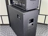 two amps stacked on top of each other on the floor