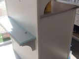 a white counter with a mirror on it in a room
