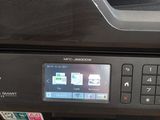 a printer that is sitting on top of a table