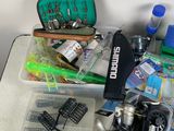 a table with a lot of fishing gear on it