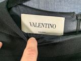 the label on the back of a black jacket reads valentinino