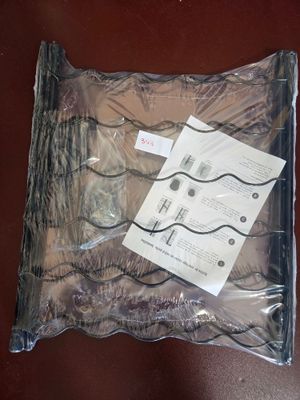 a plastic bag with a pair of scissors in it