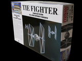 a box with a tie fighter model in it