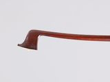 a close up of a wooden stick with a handle on a white background