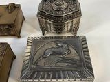 three antique silver boxes and a box with a picture of a woman
