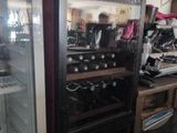 a refrigerator that has many bottles of wine inside of it