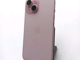 a close up of a pink iphone with a camera attached to it