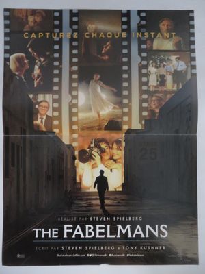 a movie poster of a man walking down a street in front of a film strip