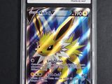 a close up of a pokemon card on a black surface