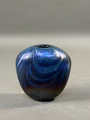 two vases that are sitting on a table