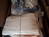 a box full of boxes and a laptop computer in it