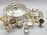 a lot of silver items that are on the table