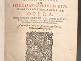 an open book with a picture of a coat of arms on it