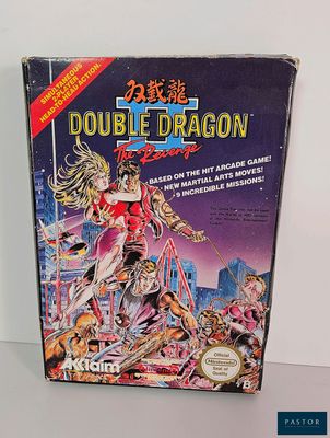 the box of the game double dragon is sitting on the table