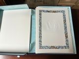 a box that has a book in it on a table